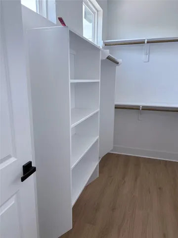 a view of an empty walk in closet