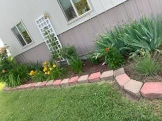 a view of a patio with a dining table and chairs