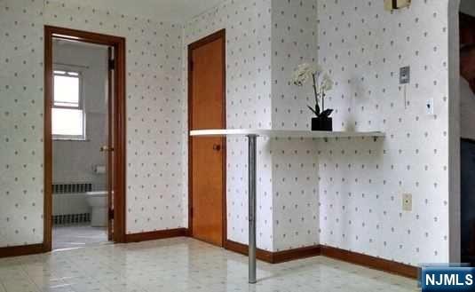 208 Columbus Place, Unit 2 Cliffside Park, NJ 07010 - Photo 3 of 9 a view of bathroom with a shower and a sink