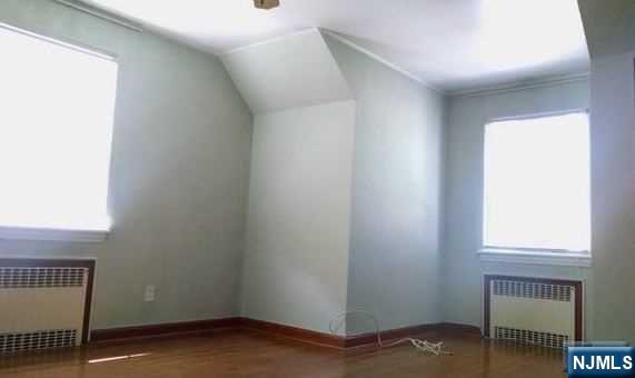 208 Columbus Place, Unit 2 Cliffside Park, NJ 07010 - Photo 6 of 9 a view of an empty room and window