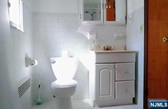 208 Columbus Place, Unit 2 Cliffside Park, NJ 07010 - Photo 9 of 9 a close view of a toilet in the bathroom