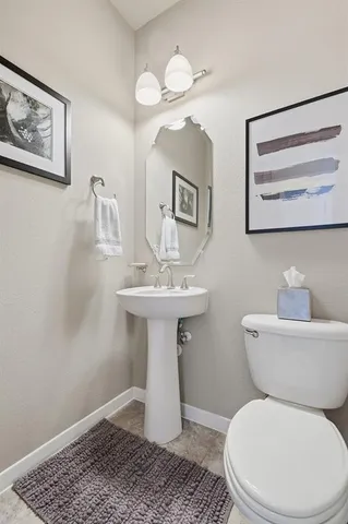 a living room with furniture and a painting on the wall