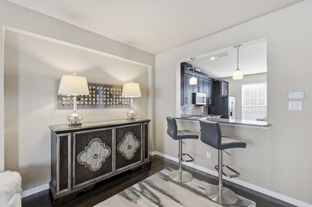 3941 Asbury Lane Addison, TX 75001 - Photo 12 of 30 a living room with furniture and a painting on the wall