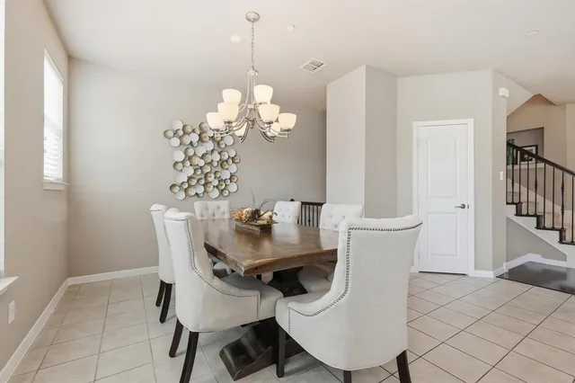 a kitchen with kitchen island granite countertop a sink stove and refrigerator