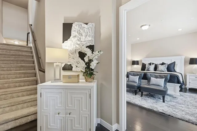 a bedroom with furniture and a wooden floor