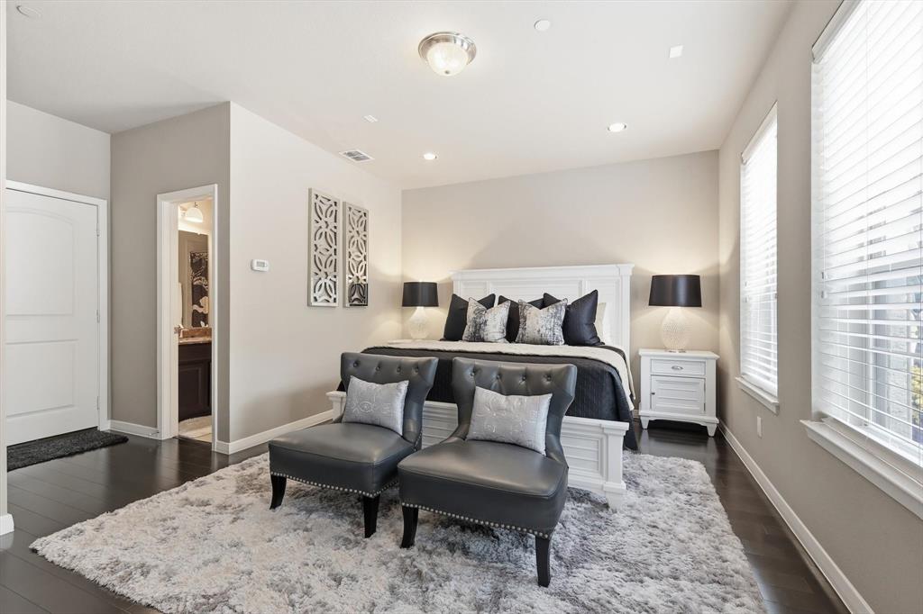 3941 Asbury Lane Addison, TX 75001 - Photo 4 of 30 a bedroom with furniture and a wooden floor