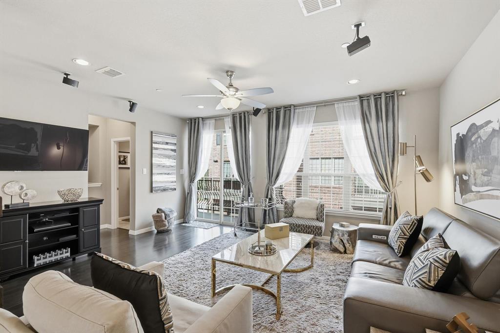 3941 Asbury Lane Addison, TX 75001 - Photo 8 of 30 a living room with furniture and a flat screen tv