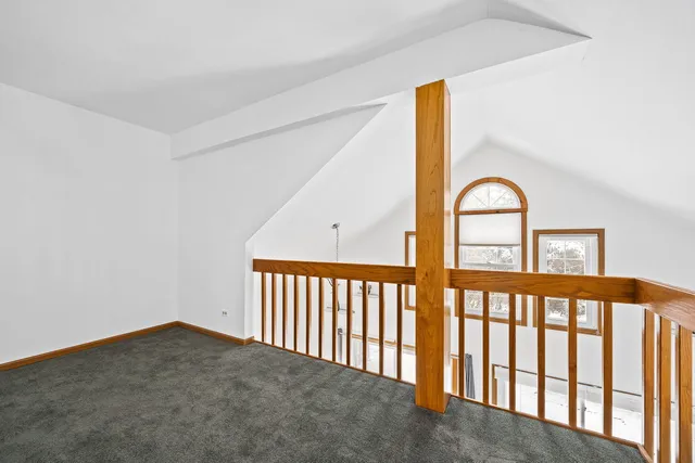 a bathroom with a granite countertop sink a mirror and shower