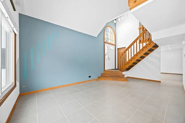 a view of an entryway with wooden floor