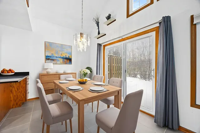 a view of a dining room with furniture window and outside view