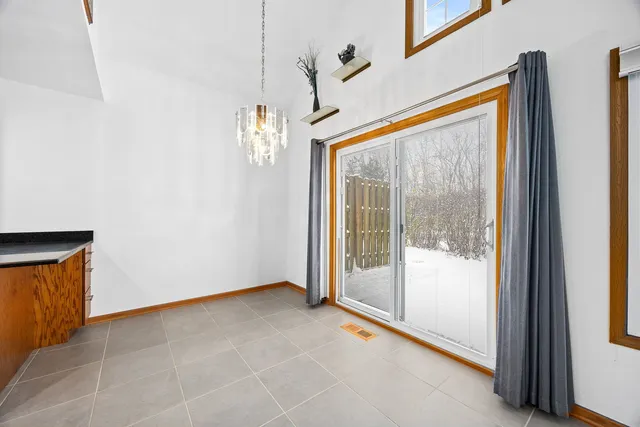 a view of a room with large windows