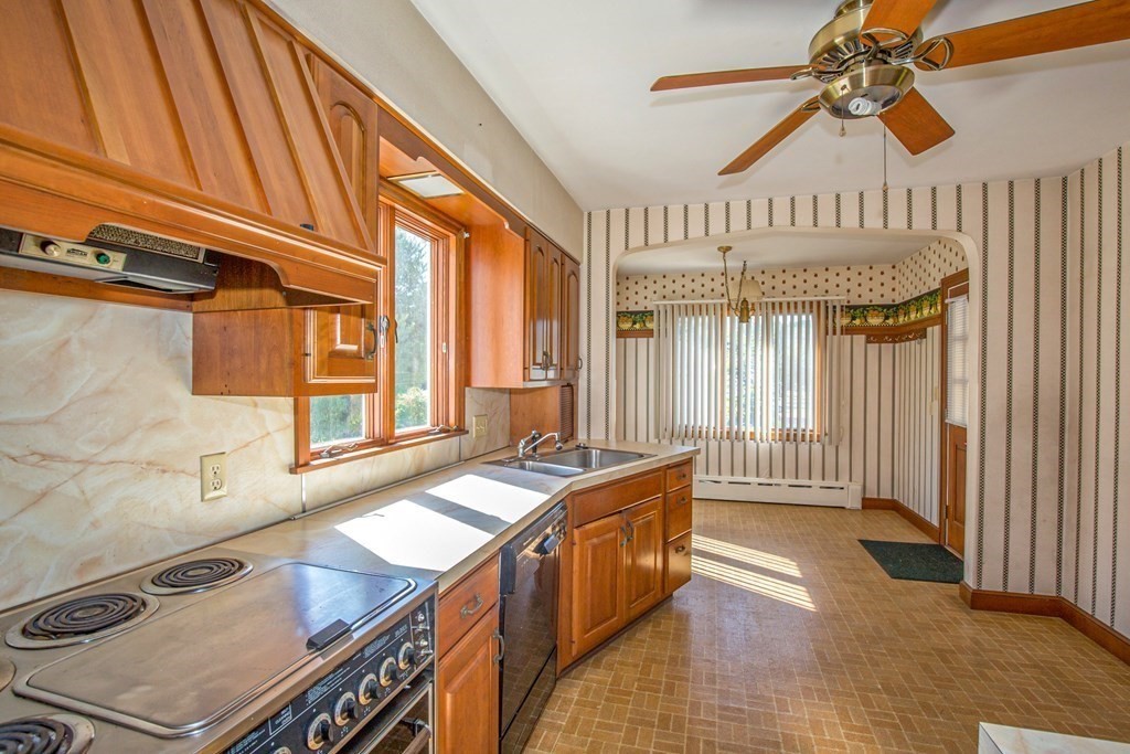 25 Belchertown Street Three Rivers, MA 01080 - Photo 13 of 32 a kitchen with a stove a sink and a refrigerator