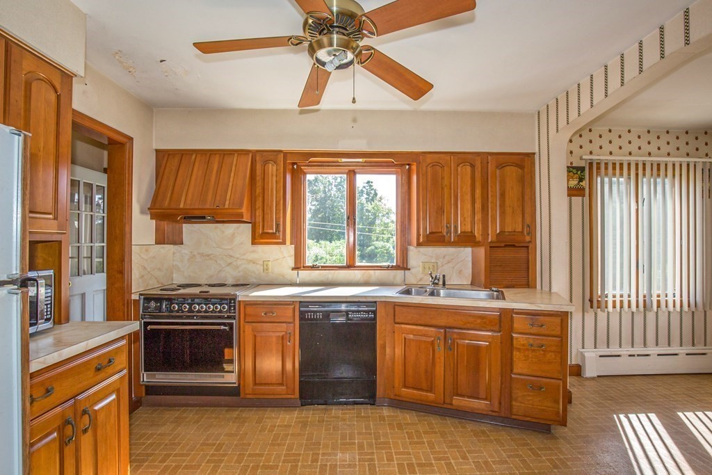 25 Belchertown Street Three Rivers, MA 01080 - Photo 14 of 32 a kitchen with a stove a sink and a refrigerator
