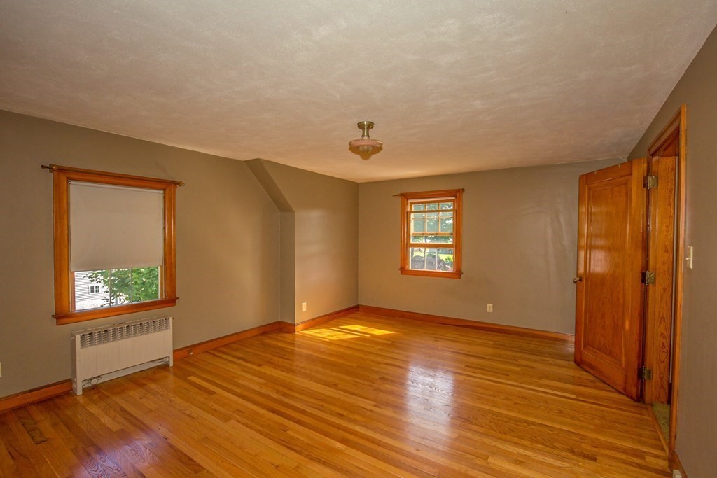 25 Belchertown Street Three Rivers, MA 01080 - Photo 21 of 32 a view of an empty room with wooden floor and a window