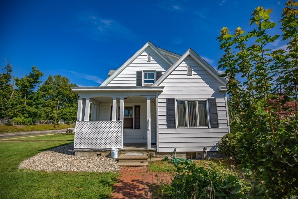 25 Belchertown Street Three Rivers, MA 01080 - Photo 3 of 32 a front view of a house with a garden