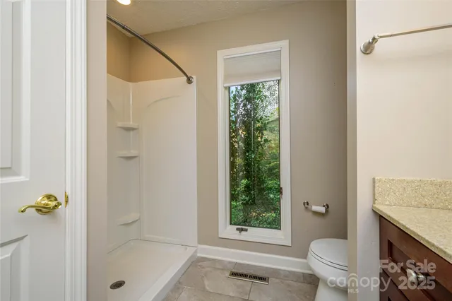 a view of a kitchen with cabinets