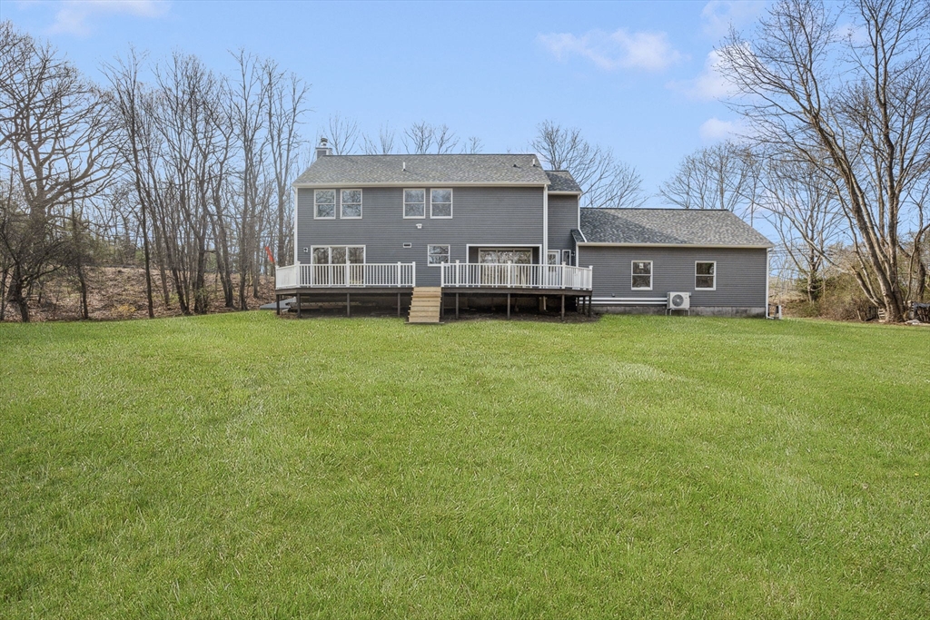 295 Frenchtown Road East Greenwich, RI 02818 - Photo 26 of 26 a view of a house with a big yard and large trees