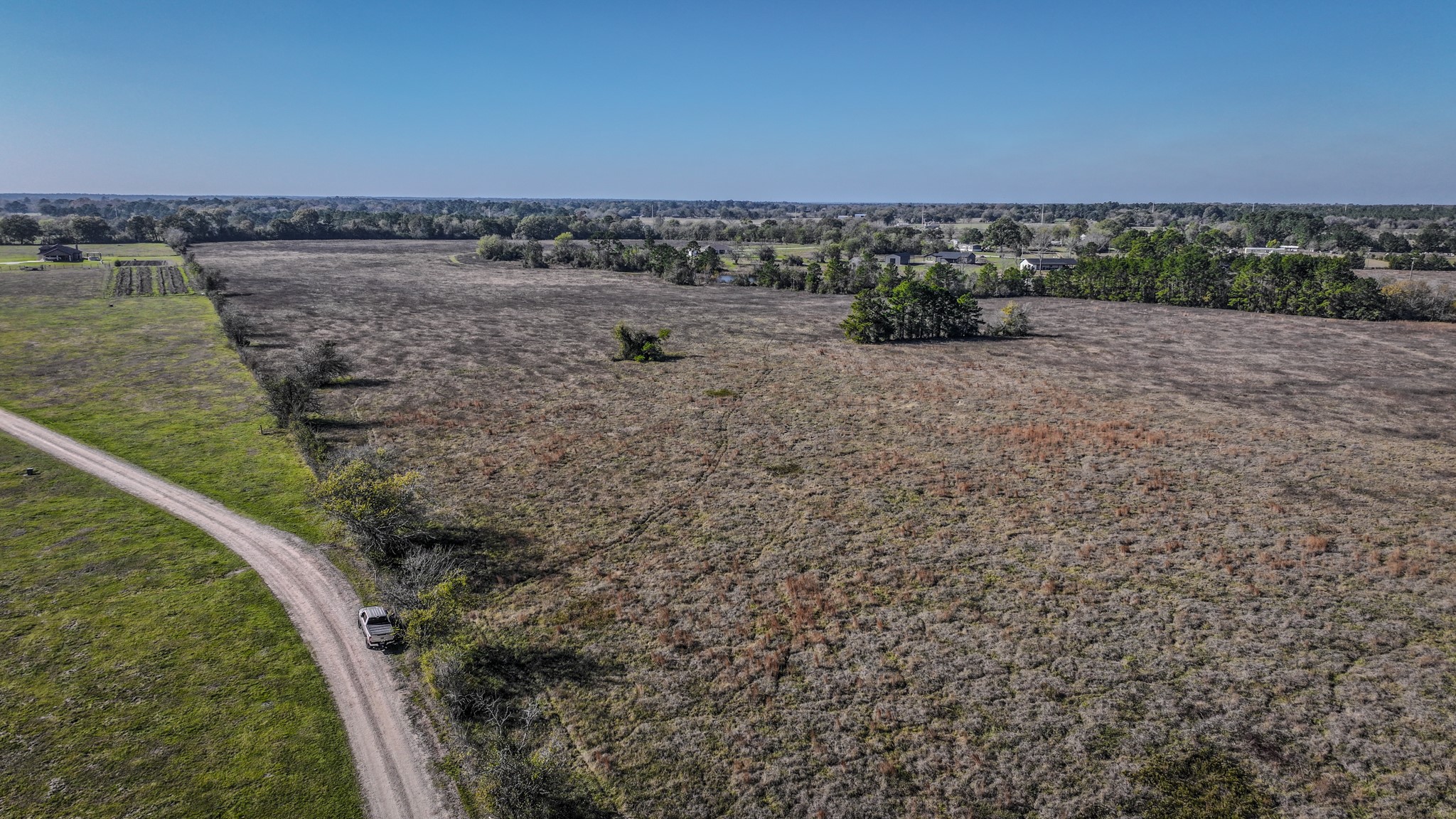 Tbd Lot 1-2 Tbd Road New Waverly, TX 77358 - Photo 2 of 29 a view of a dry yard with wooden fence