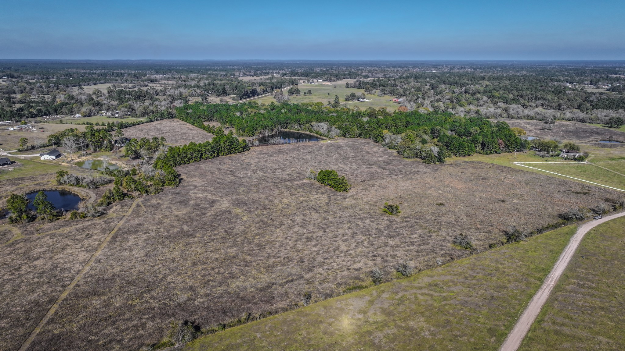 Tbd Lot 1-2 Tbd Road New Waverly, TX 77358 - Photo 21 of 29 an aerial view of a house with a yard