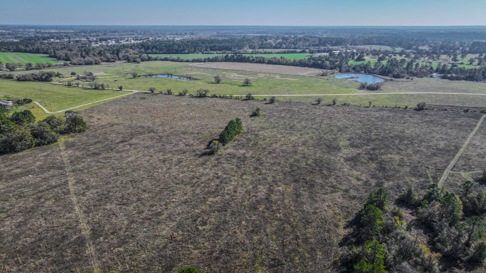 Tbd Lot 1-2 Tbd Road New Waverly, TX 77358 - Photo 25 of 29 a view of a road with an outdoor space