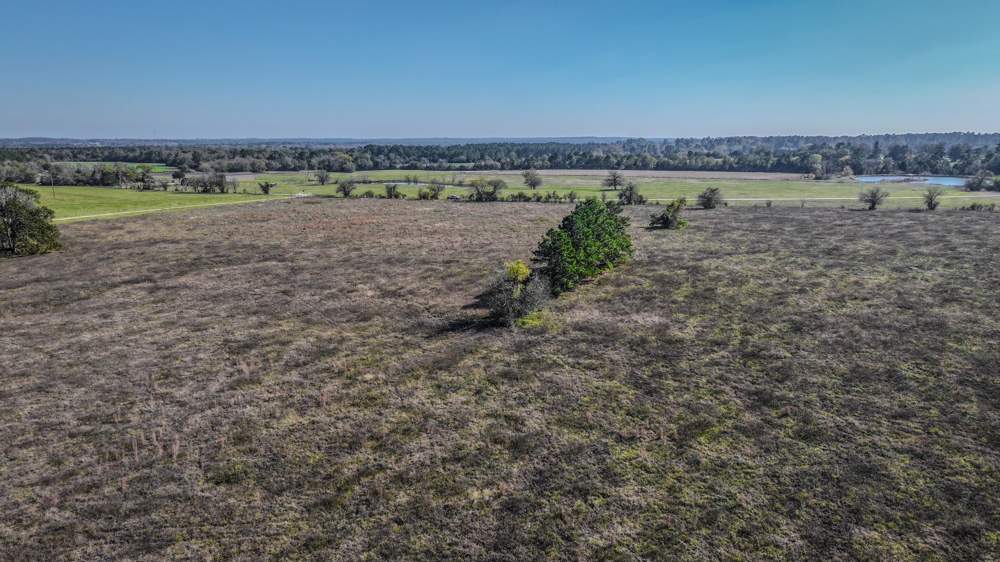 Tbd Lot 1-2 Tbd Road New Waverly, TX 77358 - Photo 26 of 29 a view of a lake with a mountain in the back