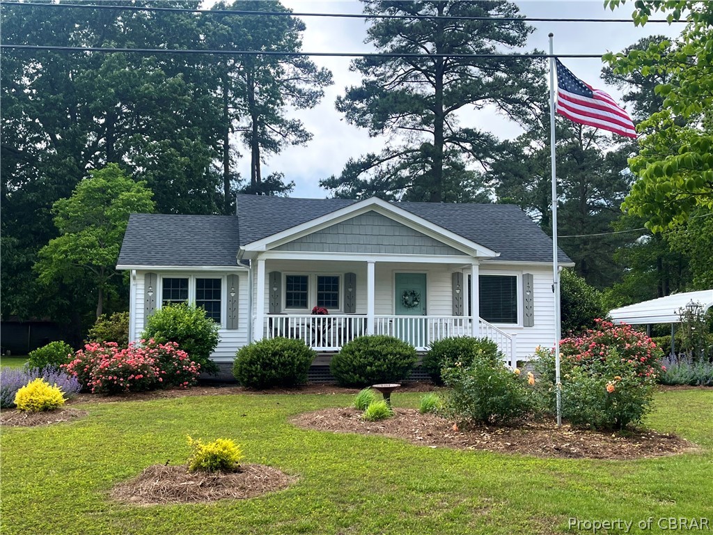 1438 Lafayette Road Gloucester Point, VA 23062 - Photo 1 of 34 View of front of home with a front lawn and a porch