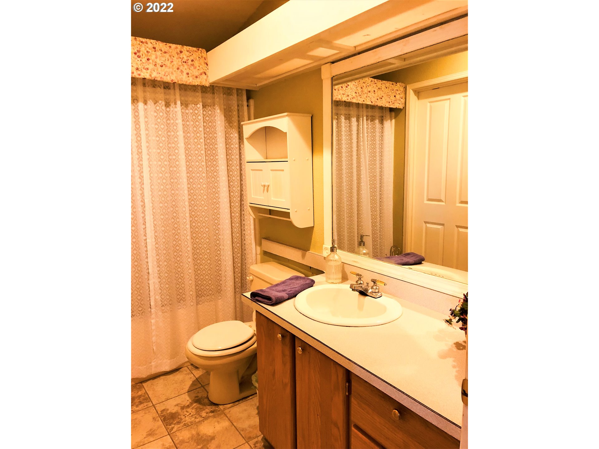 94552 Chandler Road Gold Beach, OR 97444 - Photo 23 of 28 a bathroom with a granite countertop sink toilet and shower
