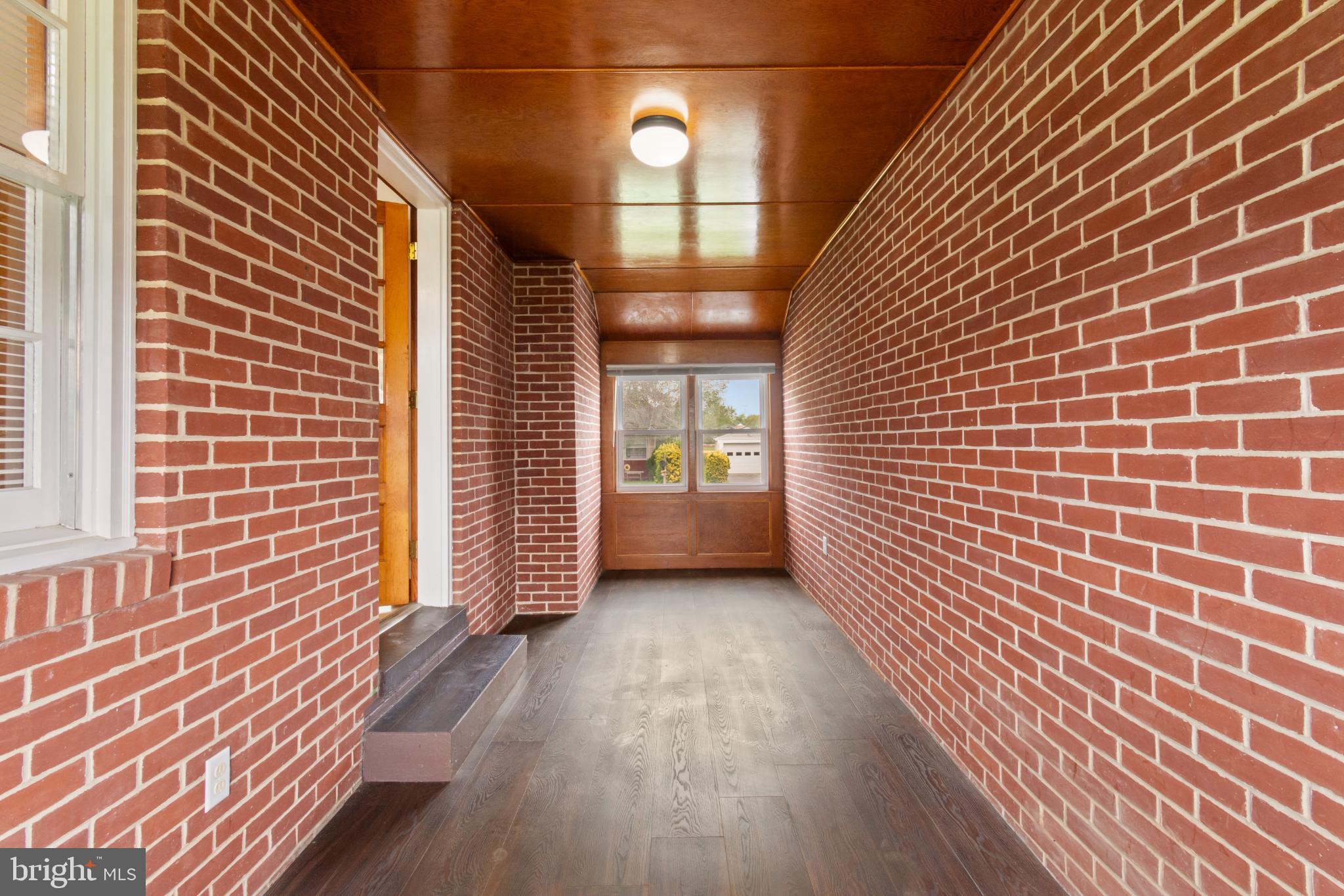 223 Carroll Heights Road Taneytown, MD 21787 - Photo 12 of 32 Inviting brick entryway with warm ambiance.