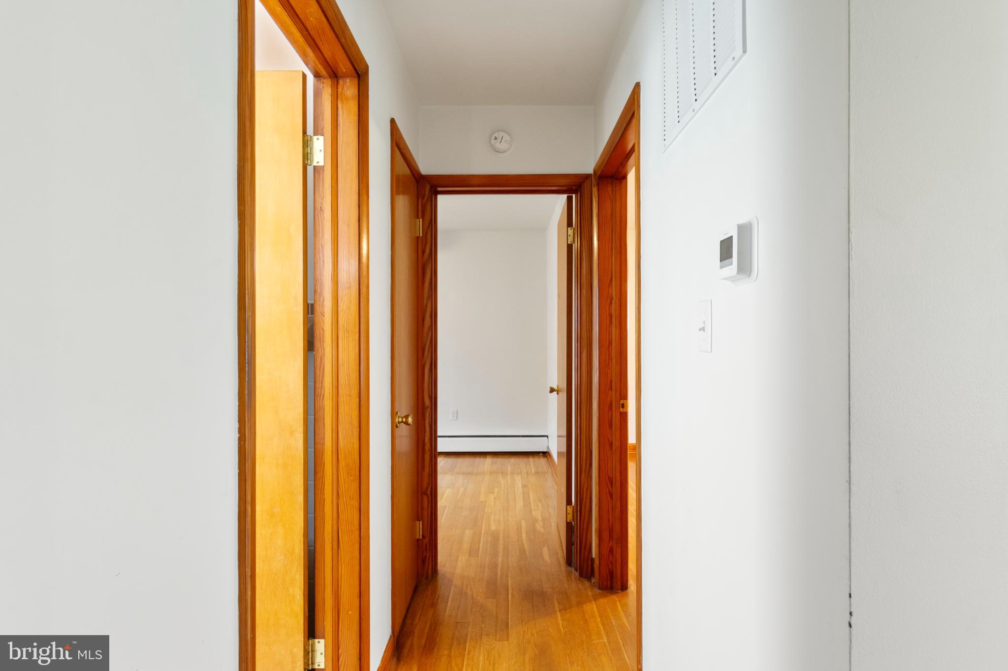 223 Carroll Heights Road Taneytown, MD 21787 - Photo 13 of 32 Inviting hallway with warm wooden accents.