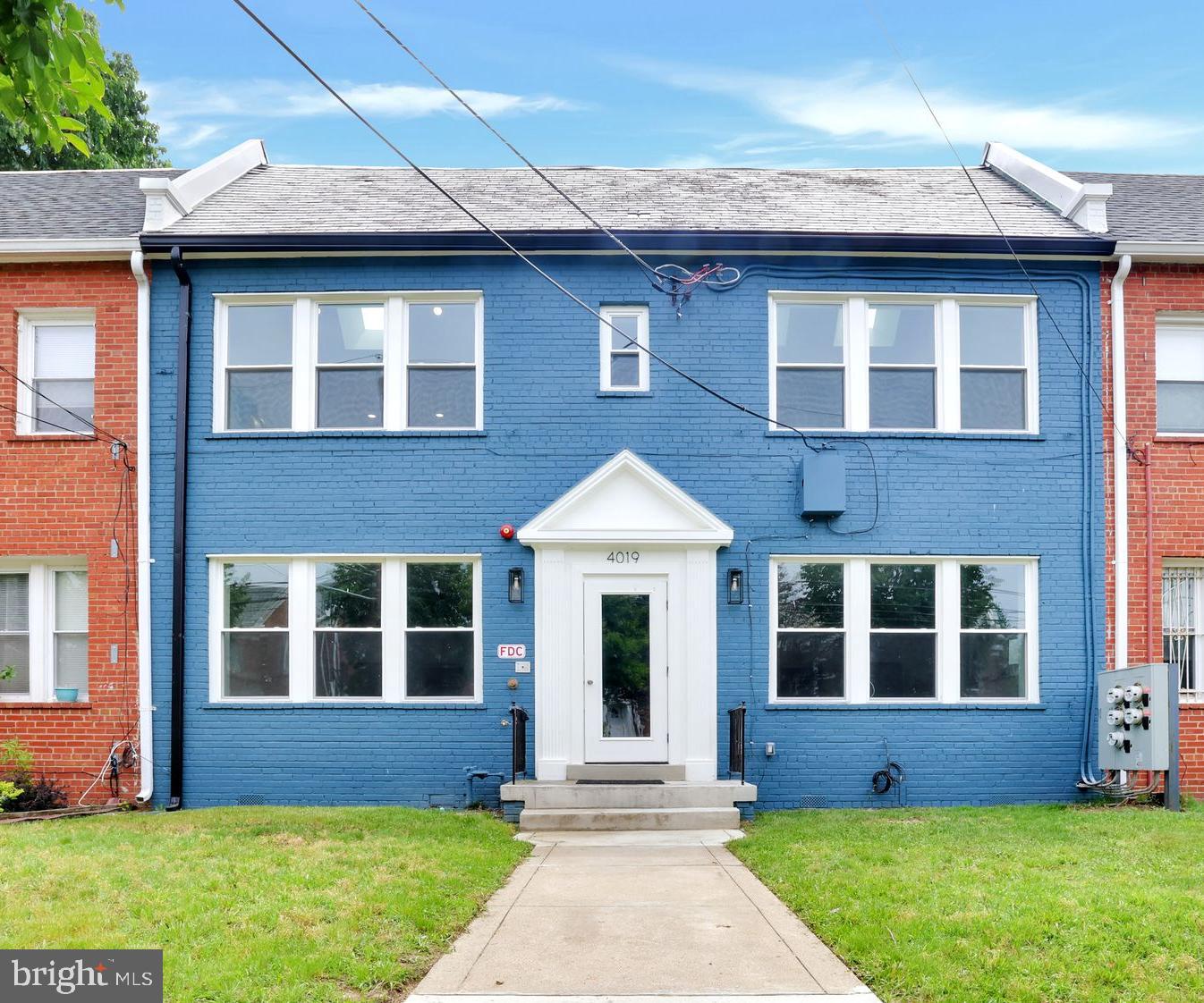 4019 9th Street Northeast, Unit 1 Washington, DC 20017 - Photo 1 of 27 a front view of a house with a yard