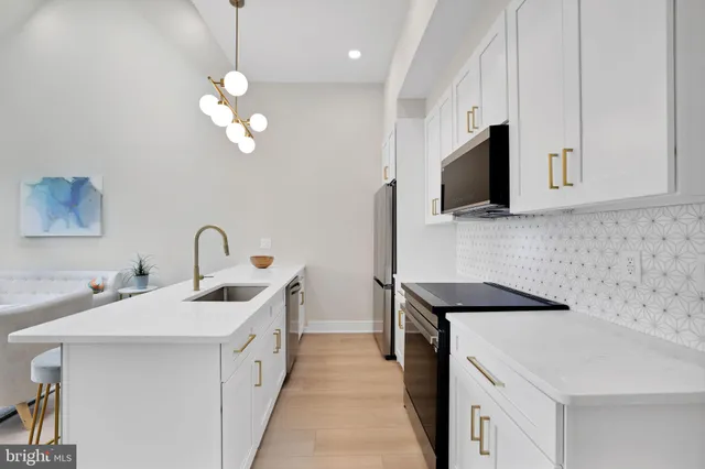 a view of a hallway with white walls