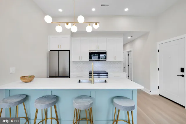 a kitchen with a table and chairs in it