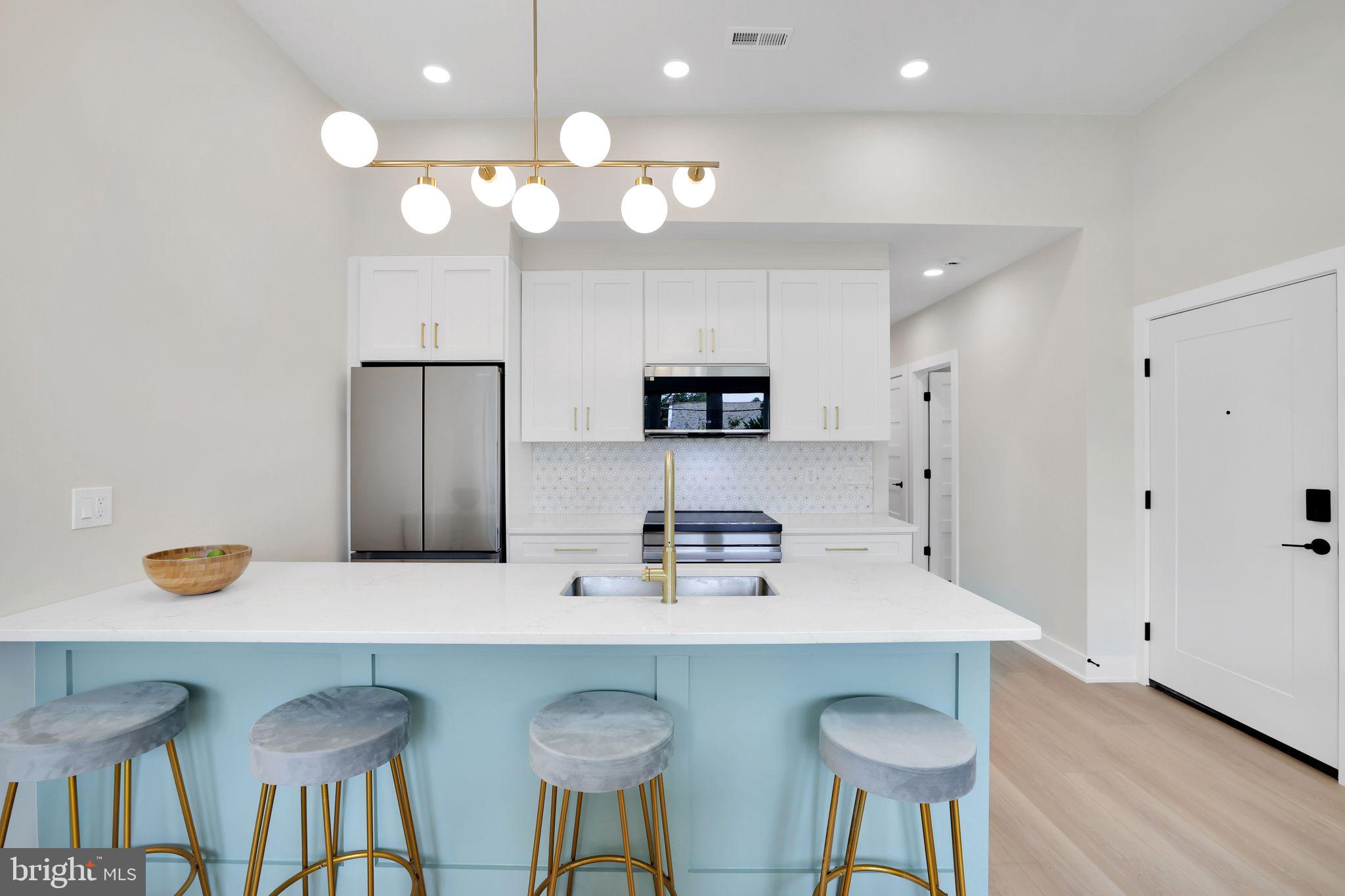 4019 9th Street Northeast, Unit 1 Washington, DC 20017 - Photo 8 of 27 a kitchen with a table and chairs in it