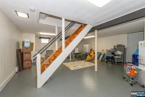 a living room with lots of furniture and a wooden floor