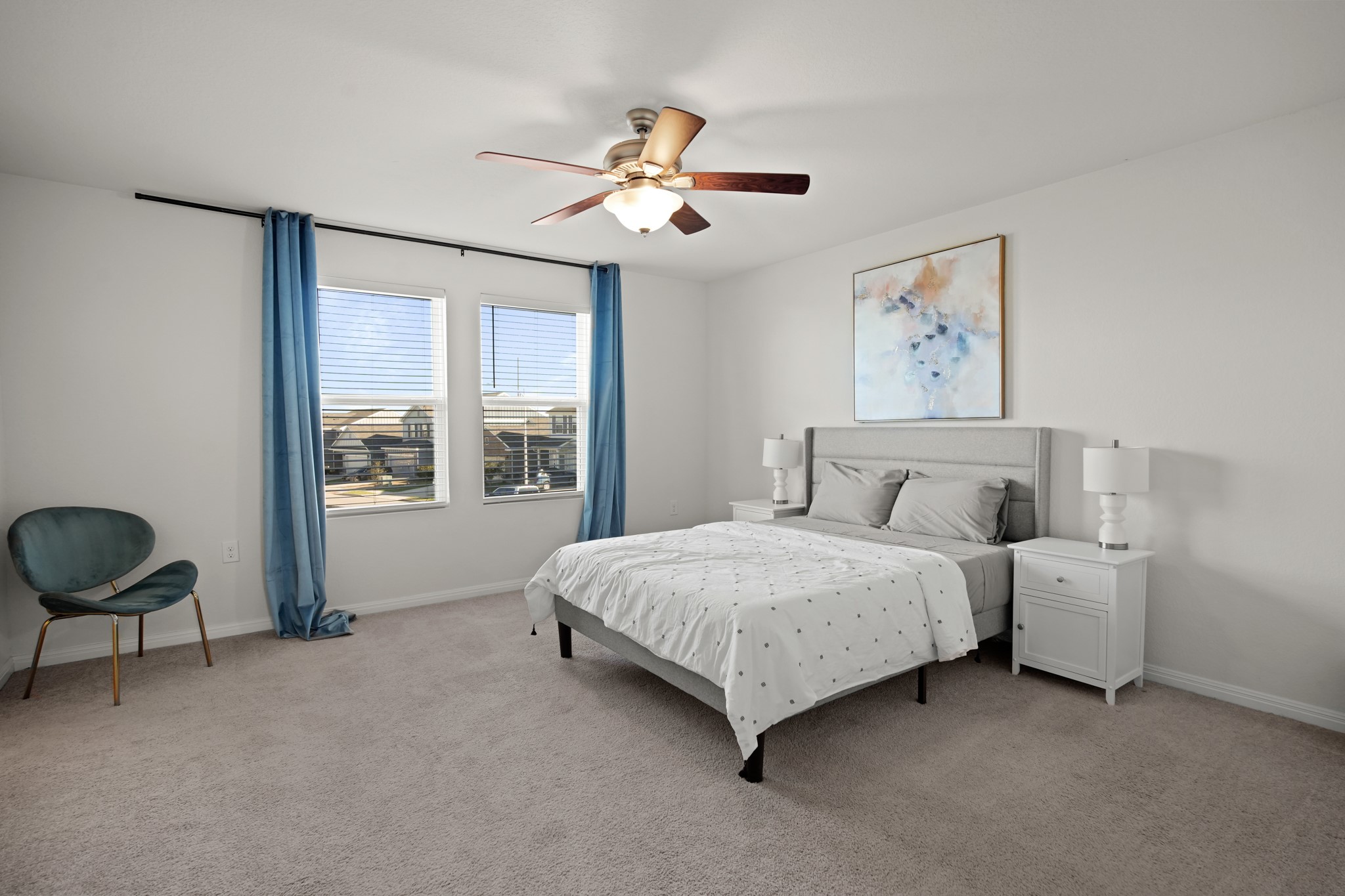 13005 Foreston Drive Austin, TX 78754 - Photo 28 of 36 a spacious bedroom with a bed and a chandelier