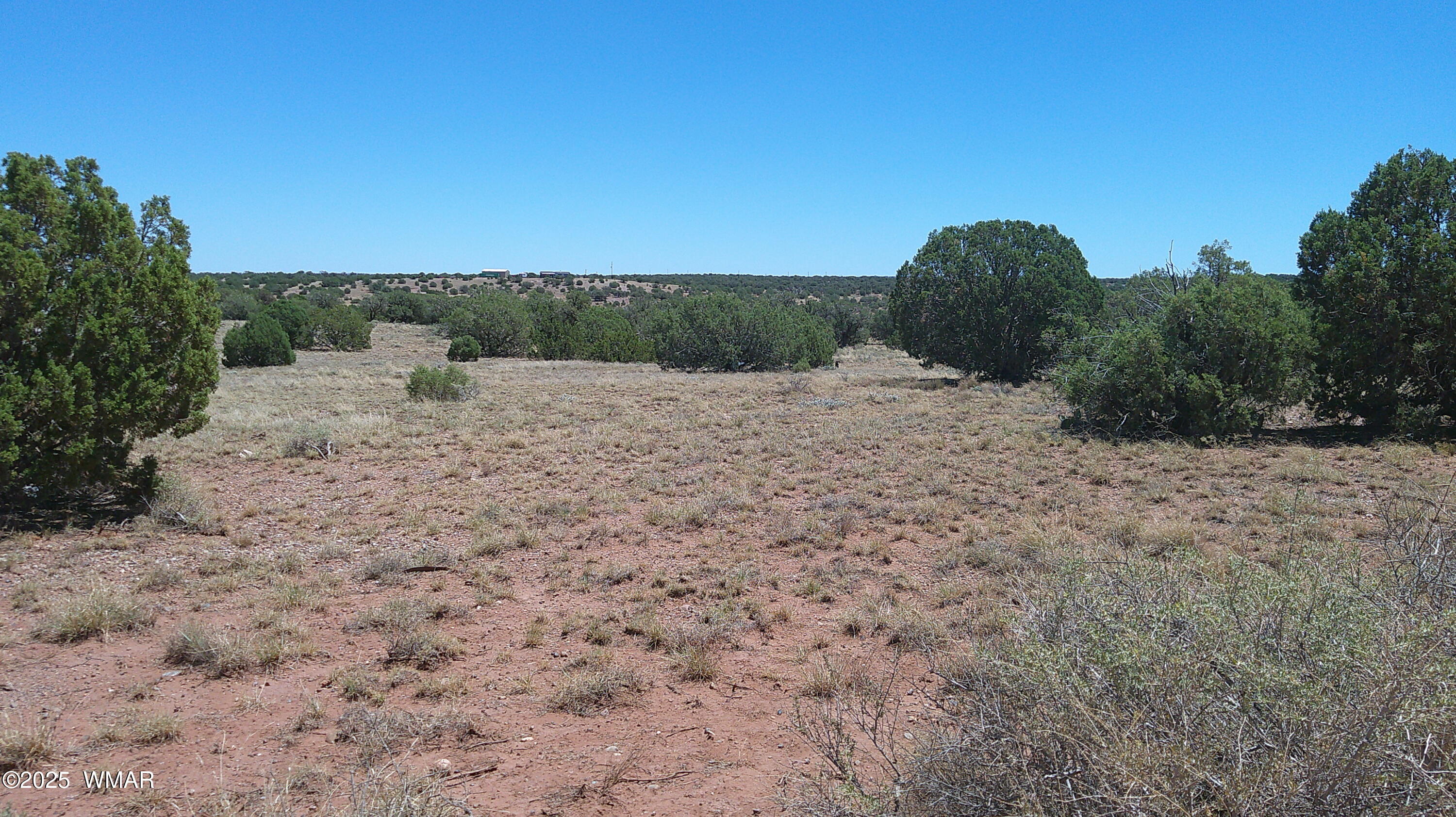 4247 East Pinto Road Snowflake, AZ 85937 - Photo 11 of 16 a view of a dry yard with wooden fence