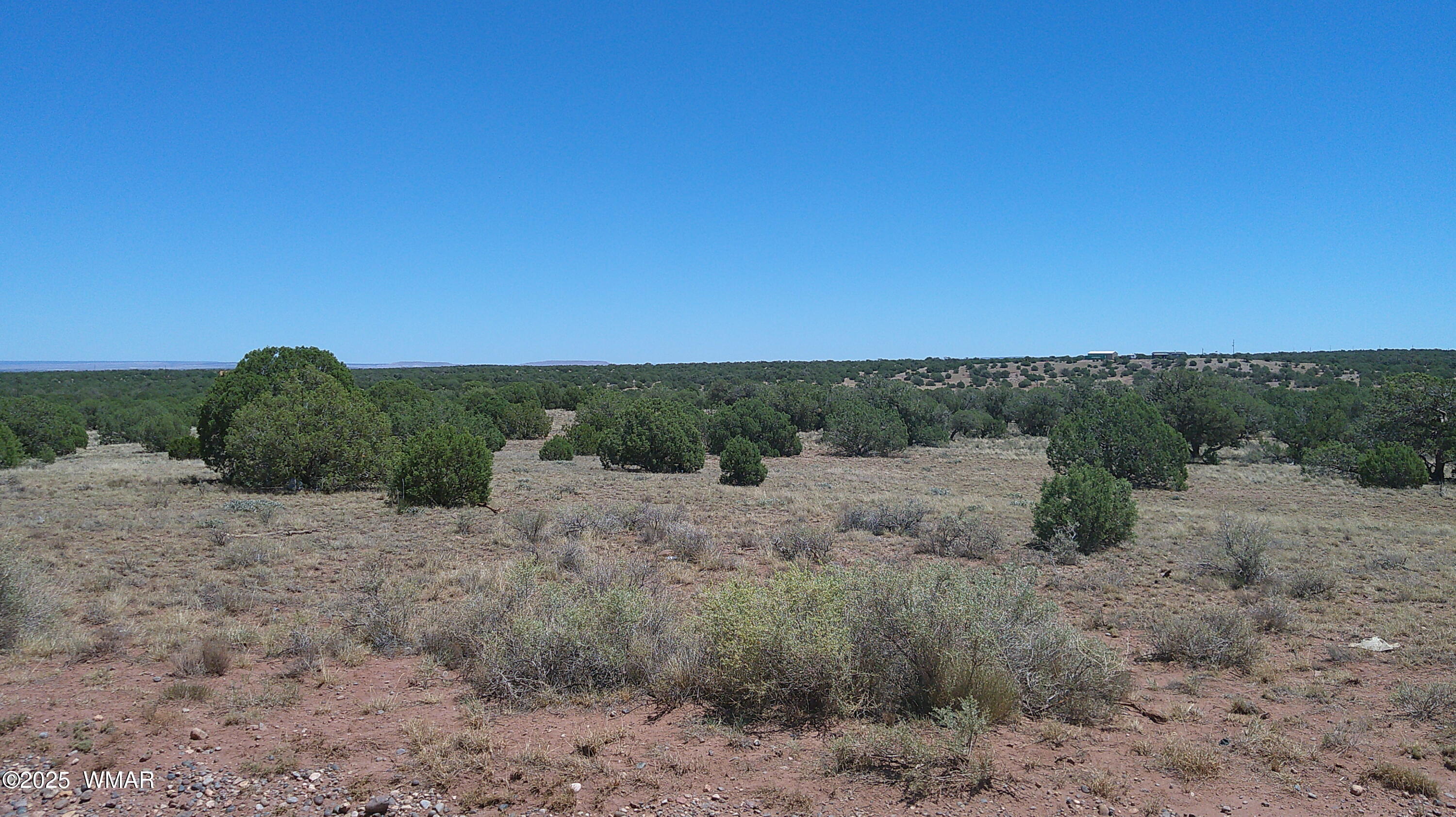4247 East Pinto Road Snowflake, AZ 85937 - Photo 10 of 16 a view of a dry yard with wooden fence