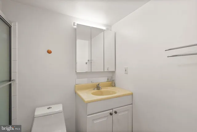 a bathroom with a sink a toilet and a tub