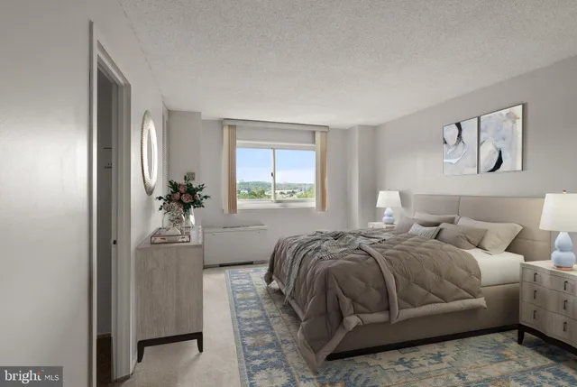 a bedroom with a bed and window