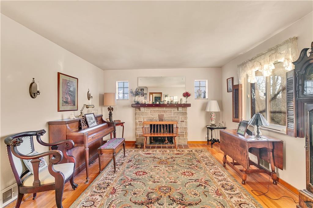 600 Colfax Street Springdale, PA 15144 - Photo 5 of 18 a living room with fireplace furniture and a large window