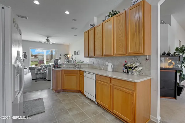 a kitchen with a refrigerator and a sink