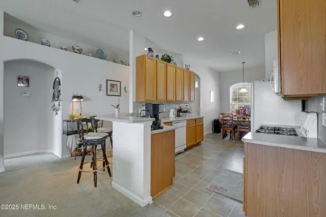 a kitchen with cabinets and a counter top space