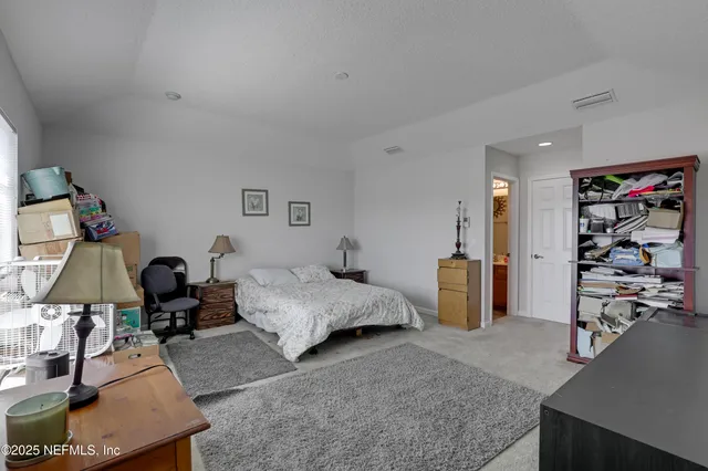 a bed room with a bed and a couch