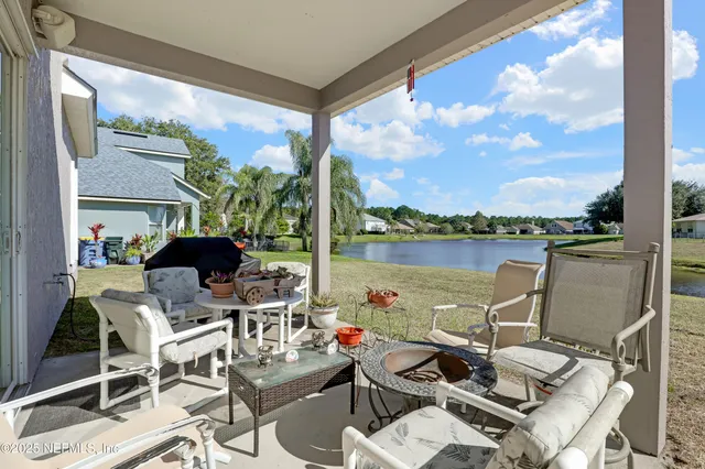a view of a terrace with furniture and a table