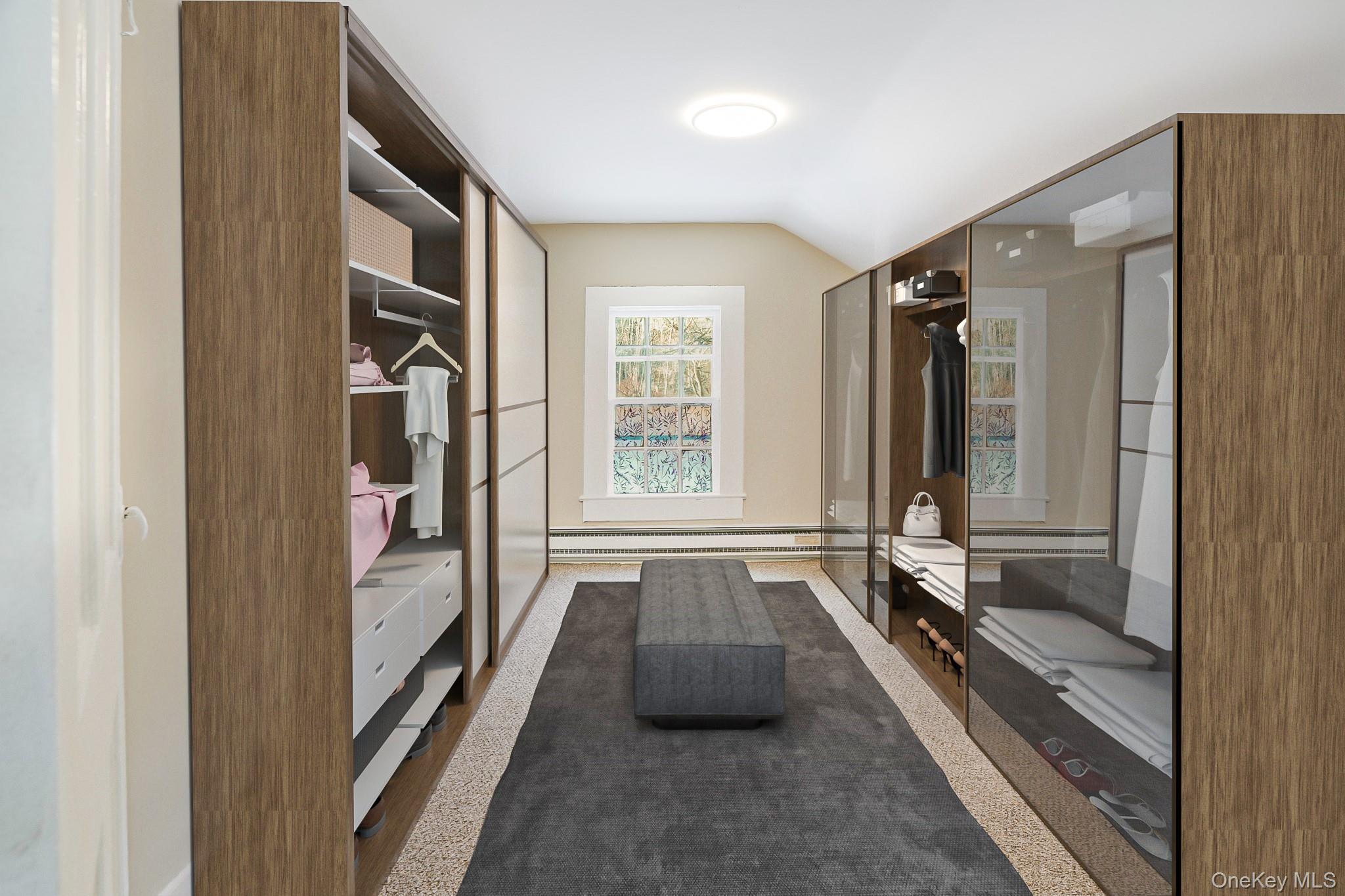 14 Old Rte 55 Pawling, NY 12564 - Photo 23 of 27 Walk in closet featuring vaulted ceiling, a baseboard radiator, and dark carpet