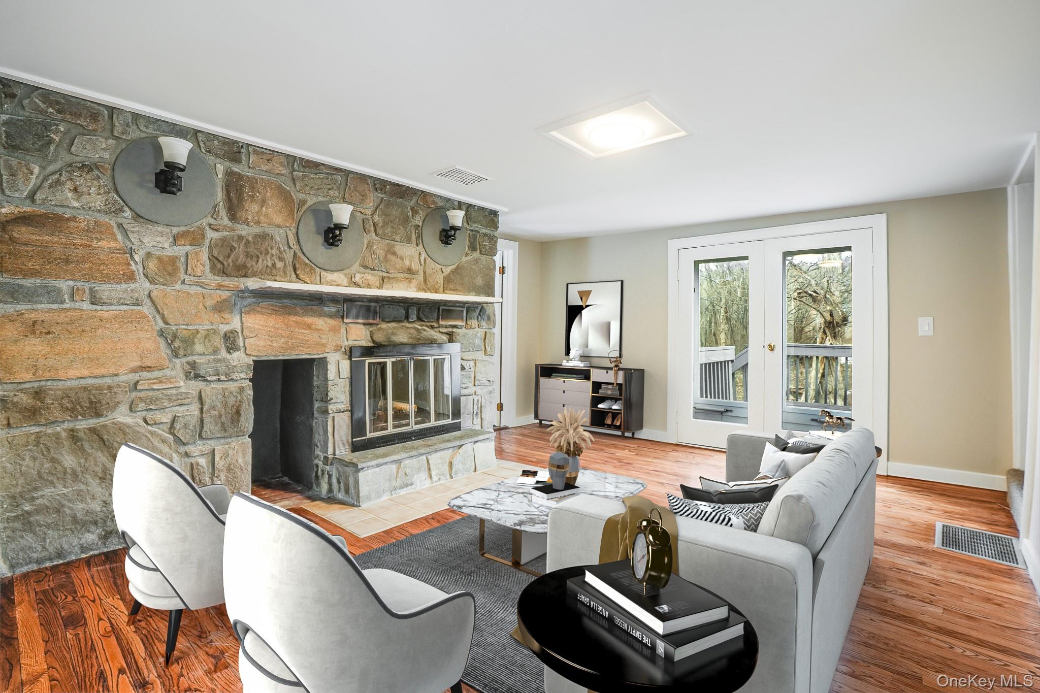 14 Old Rte 55 Pawling, NY 12564 - Photo 4 of 27 Living area with a stone fireplace and wood finished floors