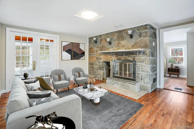 a living room with furniture and a fireplace