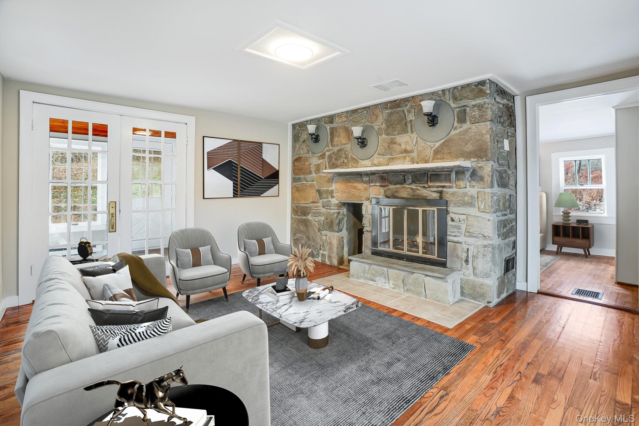 14 Old Rte 55 Pawling, NY 12564 - Photo 5 of 27 Living area with healthy amount of natural light, wood finished floors, and a fireplace
