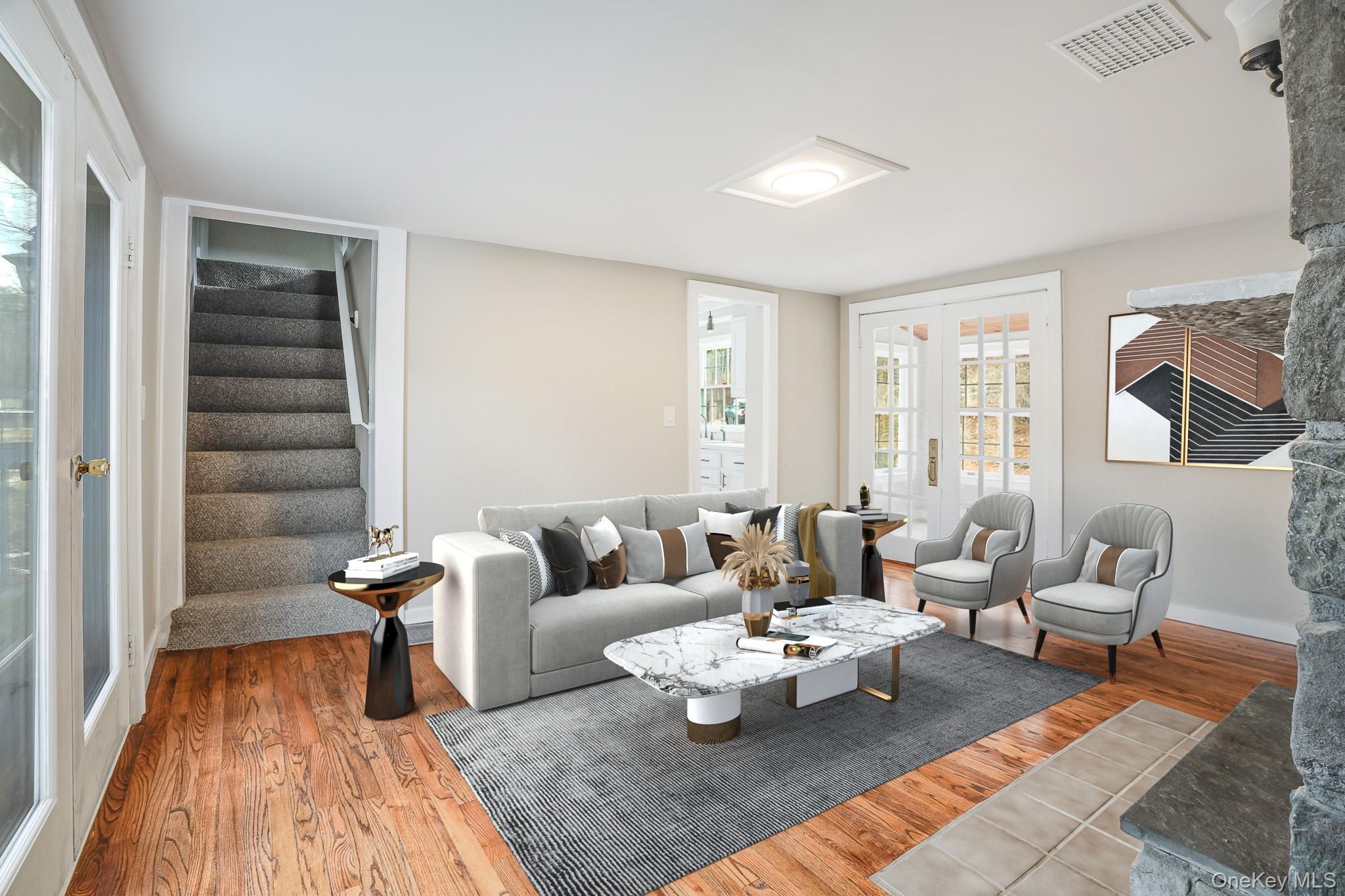 14 Old Rte 55 Pawling, NY 12564 - Photo 6 of 27 Living room with wood finished floors, stairs, and french doors