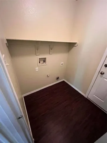 an empty room with wooden floor